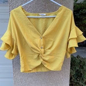 Bright yellow crop top.